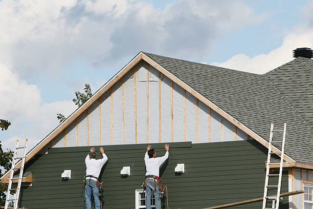 Professional Storm Damage Siding Repair technician working in West Union, OH